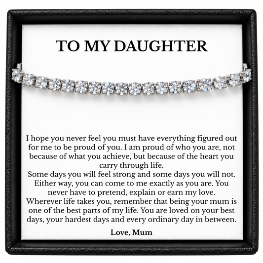 Tennis bracelet displayed across a white To My Daughter message card from Mum inside a black gift box.