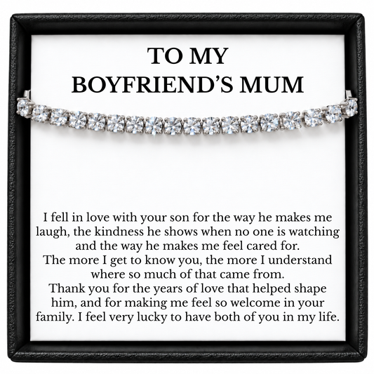 Silver-tone tennis bracelet displayed across a “To My Boyfriend’s Mum” message card in an open black gift box.