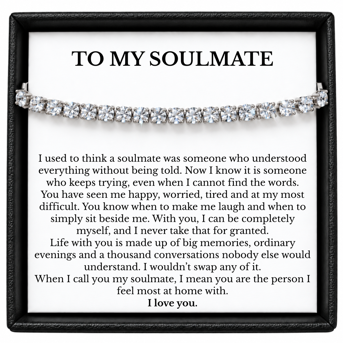 Silver tone tennis bracelet displayed across a To My Soulmate message card inside a black gift box.