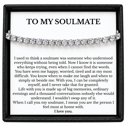 Silver tone tennis bracelet displayed across a To My Soulmate message card inside a black gift box.