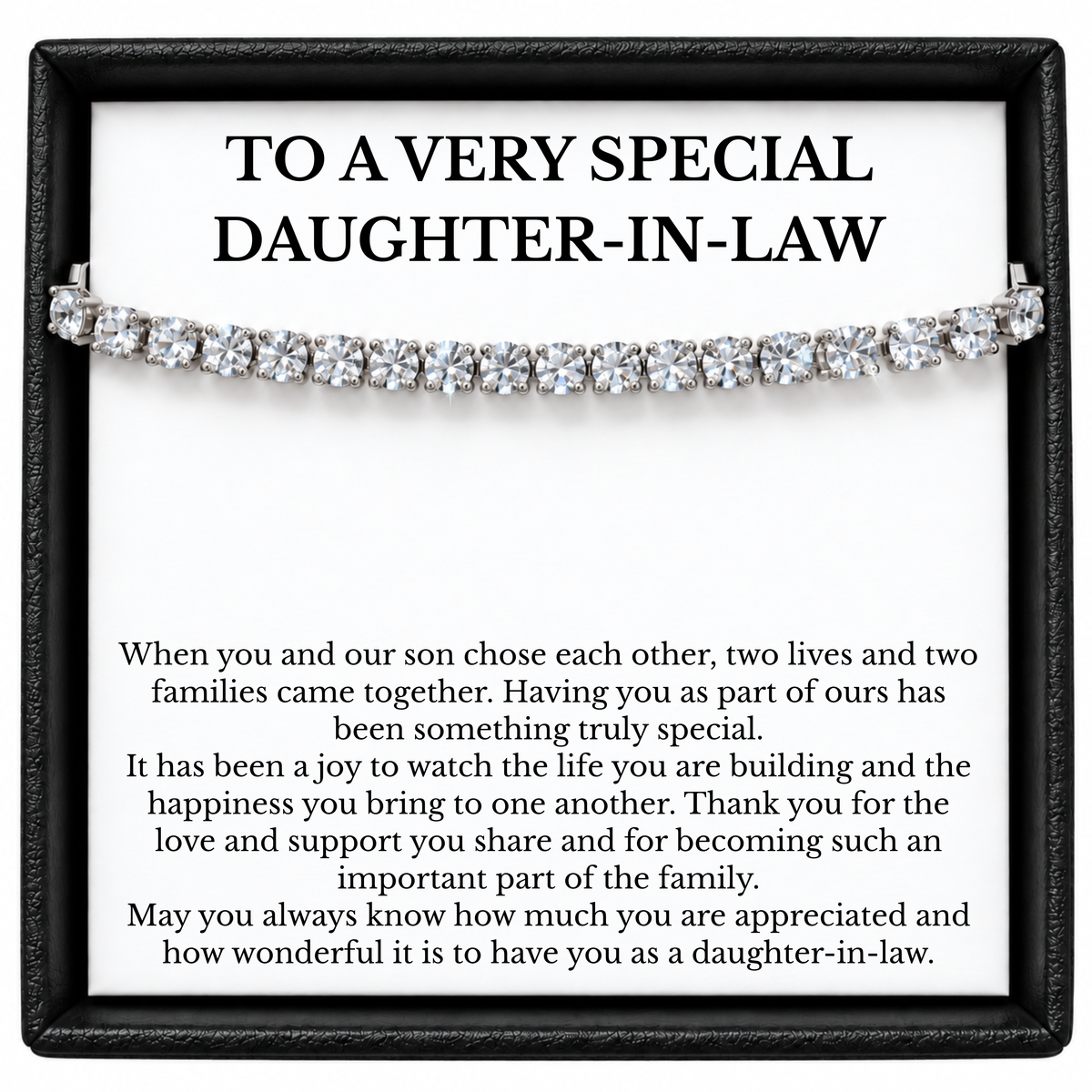 Silver-coloured tennis bracelet across a daughter-in-law message card in an open black gift box