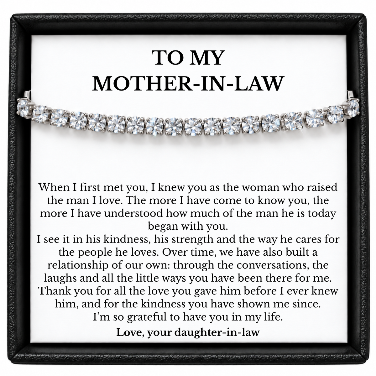 Tennis bracelet with clear stones displayed on a mother-in-law message card from her daughter-in-law inside a black gift box.