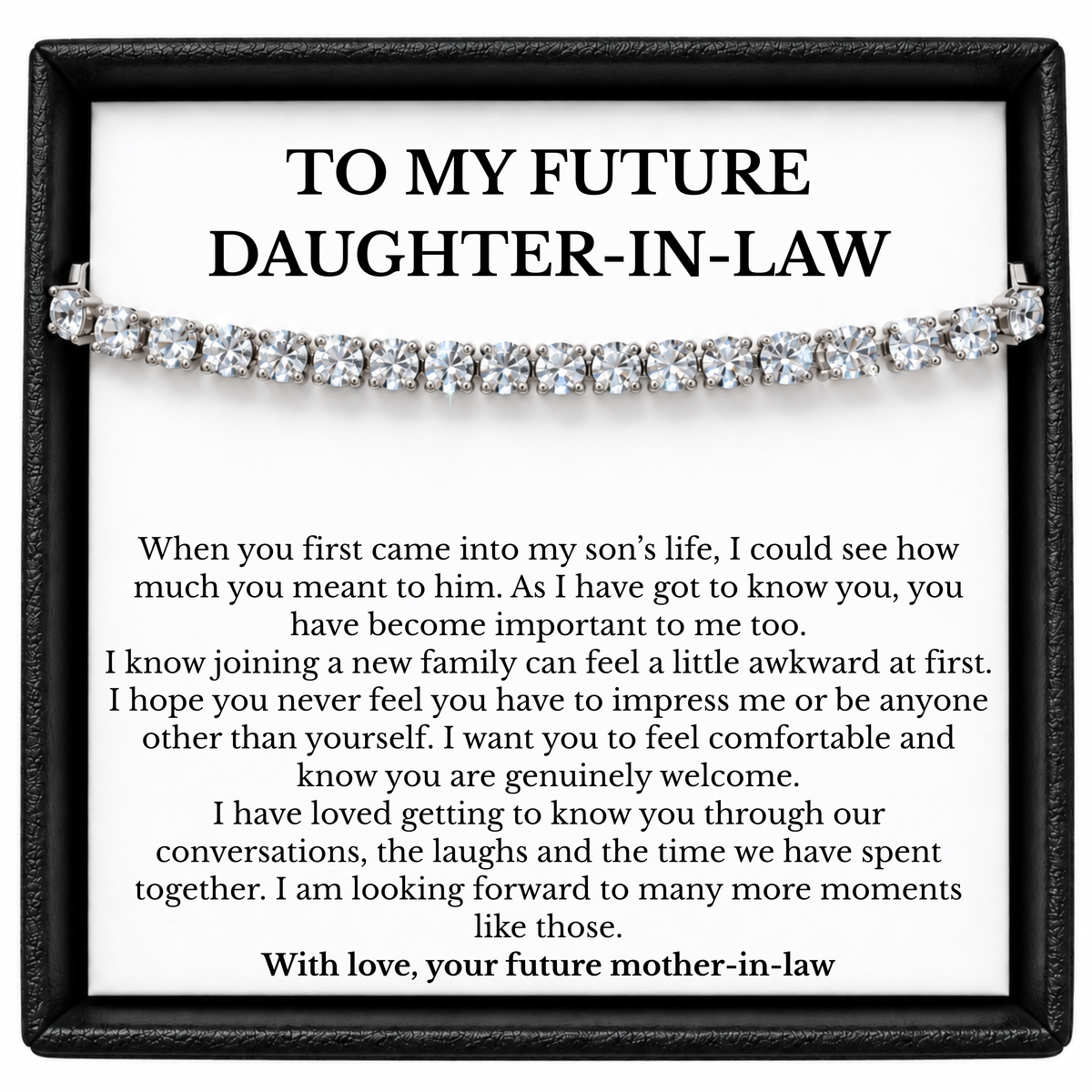 Tennis bracelet displayed over a future daughter-in-law message card from her future mother-in-law in a black gift box.