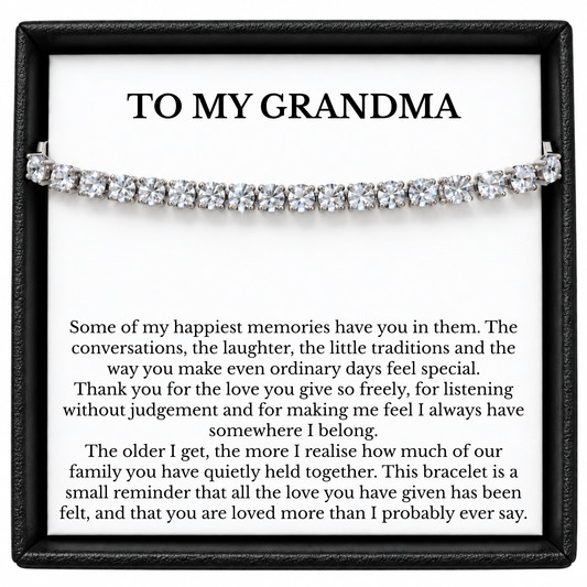 Silver-colour Grandma tennis bracelet displayed across a To My Grandma message card inside a black gift box.