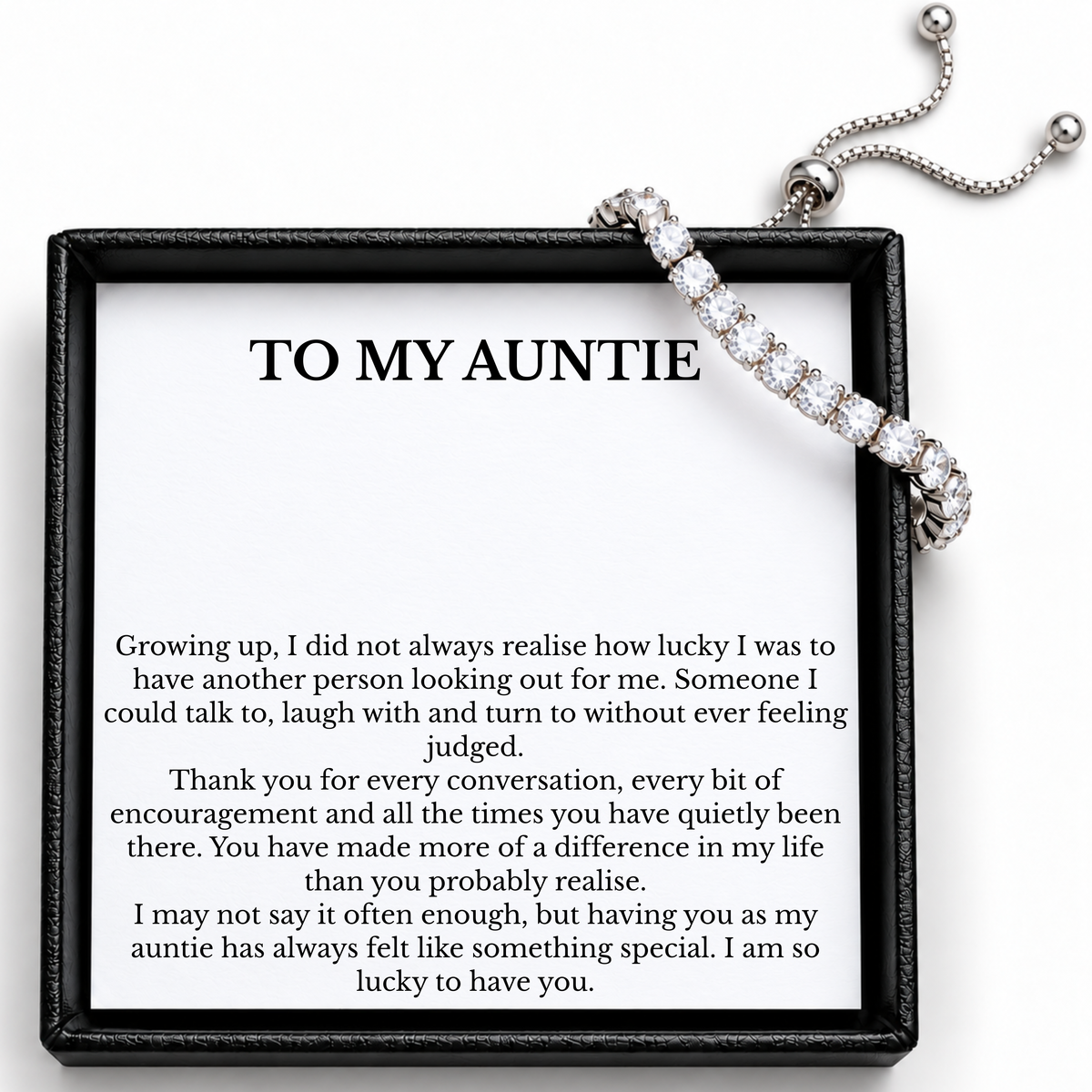 Auntie tennis bracelet showing the sliding adjuster and bead-ended chains beside its printed message card.