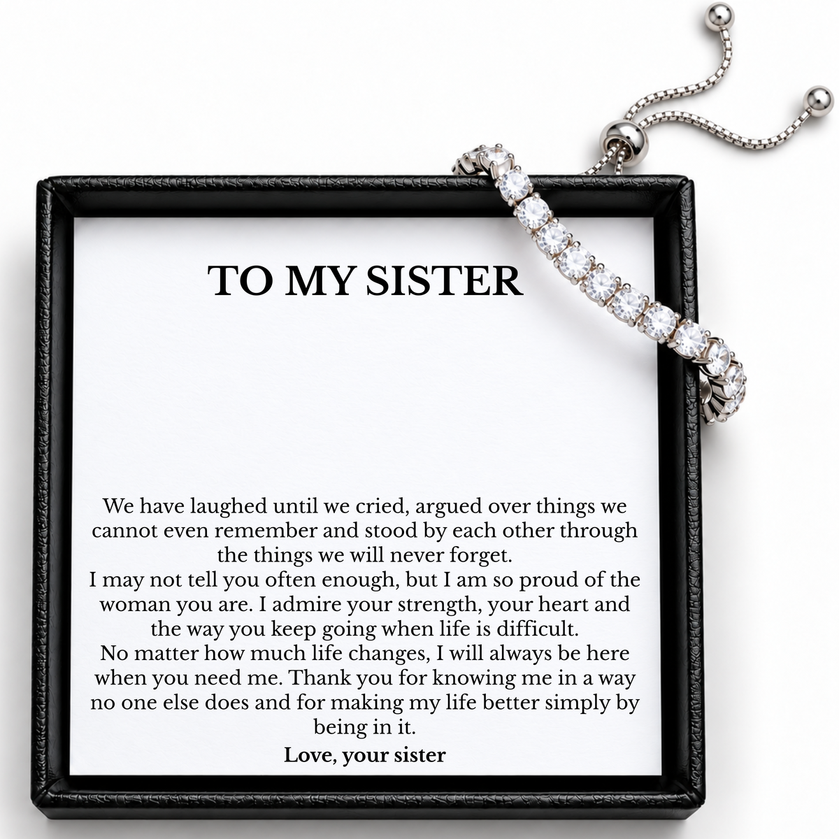 Silver-tone tennis bracelet with clear stones and sliding fastening beside the To My Sister message card.